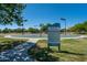 Community recreation area with basketball courts and information board at Indigo Sky at 30263 N Bobcat Way, San Tan Valley, AZ 85143