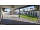 Inviting covered back patio with ceiling fan, pergola, and artificial turf at 3117 E Sweetwater Ave, Phoenix, AZ 85032