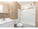 Bathroom with single vanity, tiled walls, and a shower and tub combo at 3138 W Glenrosa Ave, Phoenix, AZ 85017