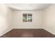 Bedroom featuring wood-look tile floors, a ceiling fan, and a window with security bars at 3138 W Glenrosa Ave, Phoenix, AZ 85017