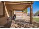 Covered back patio with string lights, and paver patio, perfect for outdoor entertainment at 317 W Settlers Trl, Casa Grande, AZ 85122