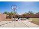 Outdoor basketball court area alongside a cozy fire pit zone with comfortable seating, backyard fun at 317 W Settlers Trl, Casa Grande, AZ 85122