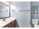 The charming half bathroom includes a sink, toilet, and framed decor at 317 W Settlers Trl, Casa Grande, AZ 85122