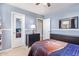 Well lit bedroom featuring a basketball themed bed, a large window, and neutral colored walls at 317 W Settlers Trl, Casa Grande, AZ 85122