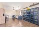 Enjoy this bright bonus room with custom shelving, laminate floors, and versatile layout at 317 W Settlers Trl, Casa Grande, AZ 85122