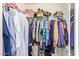 Walk-in closet with organized hanging rods and shelving, providing ample storage space at 317 W Settlers Trl, Casa Grande, AZ 85122