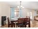 Cozy dining area featuring wooden table and chairs, and a modern light fixture at 317 W Settlers Trl, Casa Grande, AZ 85122