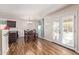 Bright dining area with wood table, access to the outdoors, and modern light fixture at 317 W Settlers Trl, Casa Grande, AZ 85122