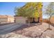 Two story home with an attached garage, desert landscaping and a covered porch seating area at 317 W Settlers Trl, Casa Grande, AZ 85122