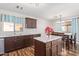 Well-lit kitchen with granite countertops, stainless appliances, and a view into the dining area at 317 W Settlers Trl, Casa Grande, AZ 85122