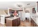 Charming kitchen with stainless steel appliances, granite countertops, and wooden cabinetry at 317 W Settlers Trl, Casa Grande, AZ 85122