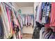 A large walk-in closet with hardwood floors and custom shelving for maximum storage at 317 W Settlers Trl, Casa Grande, AZ 85122