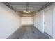 Spacious garage featuring an automatic door opener and overhead storage rack at 3236 E Chandler Blvd # 2067, Phoenix, AZ 85048