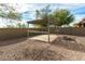 A patio space with pergola, bar seating, and desert landscaping offering privacy and relaxation at 39559 N Prairie Ln, Anthem, AZ 85086