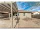 Spacious backyard featuring a covered patio area, a pergola and desert landscaping at 39559 N Prairie Ln, Anthem, AZ 85086