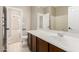 Bathroom with a sink vanity, framed mirror, and open doorway at 39559 N Prairie Ln, Anthem, AZ 85086