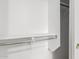 Spacious closet with white shelving and built-in metal rod for clothing storage at 39559 N Prairie Ln, Anthem, AZ 85086