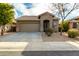 Charming single-story home featuring a low-maintenance desert landscape and neutral color palette at 39559 N Prairie Ln, Anthem, AZ 85086