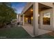 The covered patio with an outdoor seating area and a fire pit is perfect for evening relaxation at 42072 W Dorsey Dr, Maricopa, AZ 85138