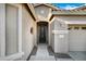 Inviting entryway featuring decorative front door, covered porch, and well-maintained landscaping enhancing curb appeal at 42072 W Dorsey Dr, Maricopa, AZ 85138
