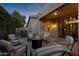 Enjoy the backyard patio with comfortable seating arranged around a fire pit for outdoor gatherings at 42072 W Dorsey Dr, Maricopa, AZ 85138