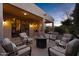 A backyard patio featuring comfortable seating arranged around a fire pit for outdoor relaxation at 42072 W Dorsey Dr, Maricopa, AZ 85138