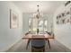 Dining room with shuttered windows, modern light fixtures, and seating for six people at 4718 N 35Th Way, Phoenix, AZ 85018