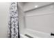 Bright bathroom with a white tiled shower and a stylish shower curtain for a fresh look at 520 E Jahns Pl, Casa Grande, AZ 85122