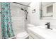 Modern bathroom features a walk-in shower with decorative curtain at 520 E Jahns Pl, Casa Grande, AZ 85122