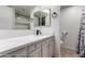 Bathroom features updated vanity with stone countertop and modern black faucet at 520 E Jahns Pl, Casa Grande, AZ 85122
