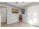 The bedroom has neutral walls, ceramic tile floors, and a closet with sliding doors at 520 E Jahns Pl, Casa Grande, AZ 85122