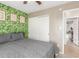 Bedroom with decorative wallpaper and a closet at 520 E Jahns Pl, Casa Grande, AZ 85122