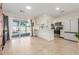 Bright eat-in kitchen featuring stainless steel appliances, a breakfast bar, and sliding glass doors to the backyard at 520 E Jahns Pl, Casa Grande, AZ 85122