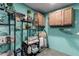 Laundry room boasts ample storage cabinets, stylish decor, and functional laundry aids at 520 E Jahns Pl, Casa Grande, AZ 85122