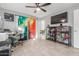 Bright living room with tile flooring, a ceiling fan, and a view from the window at 520 E Jahns Pl, Casa Grande, AZ 85122