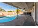 View of the pool and covered patio area, perfect for outdoor relaxation and entertaining at 520 E Jahns Pl, Casa Grande, AZ 85122