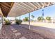 Outdoor view with a patio cover and desert landscaping at 545 N 98Th St, Mesa, AZ 85207