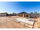 Backyard with concrete patio, seating area, and wooden fence at 545 N 98Th St, Mesa, AZ 85207