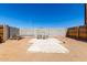 Backyard seating area with concrete patio and block wall at 545 N 98Th St, Mesa, AZ 85207