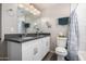 Bright bathroom featuring a double sink vanity with modern fixtures and gray countertops at 545 N 98Th St, Mesa, AZ 85207