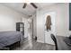 Bedroom with a bed, desk, and gray wood-look flooring at 545 N 98Th St, Mesa, AZ 85207