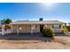 Charming single-story home with a covered porch and xeriscape landscaping at 545 N 98Th St, Mesa, AZ 85207