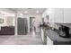 Bright kitchen with white cabinets, stainless steel appliances, and gray countertops at 545 N 98Th St, Mesa, AZ 85207