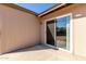 Covered patio area featuring a sliding glass door with access to the backyard at 545 N 98Th St, Mesa, AZ 85207