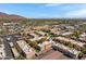 Community aerial view showing the beautiful pool, covered parking and mountain views at 5525 E Thomas Rd # O8, Phoenix, AZ 85018