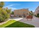 Community BBQ area with stainless steel grills, a seating bench, and adjacent grassy lawn, perfect for outdoor gatherings at 5525 E Thomas Rd # O8, Phoenix, AZ 85018