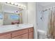 Bathroom features a shower, toilet, vanity with updated sink and lighting at 5525 E Thomas Rd # O8, Phoenix, AZ 85018
