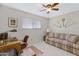 Bedroom with ceiling fan, desk, sofa, carpet flooring, and natural light at 5525 E Thomas Rd # O8, Phoenix, AZ 85018