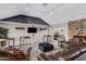 Clubhouse lounge with leather seating, fireplace, TV, and stylish decor, creating a warm and inviting gathering space at 5525 E Thomas Rd # O8, Phoenix, AZ 85018