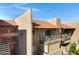 Exterior of home featuring balconies, tile roofs and desert landscaping at 5525 E Thomas Rd # O8, Phoenix, AZ 85018